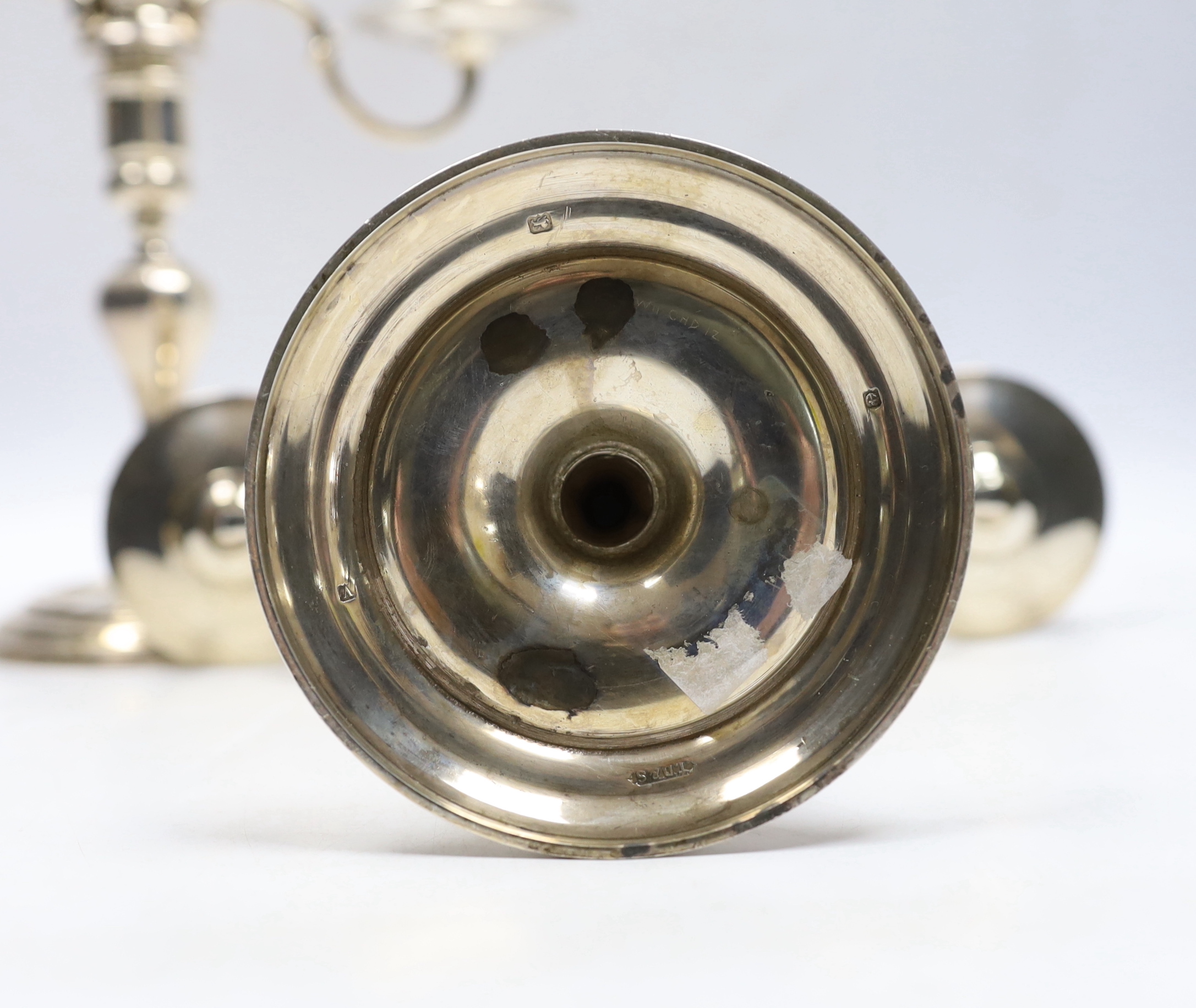 A pair of George VI silver two branch, two light candelabra, Thomas Ducrow & Sons, Birmingham, 1945, height 20.8cm, 44.6oz.